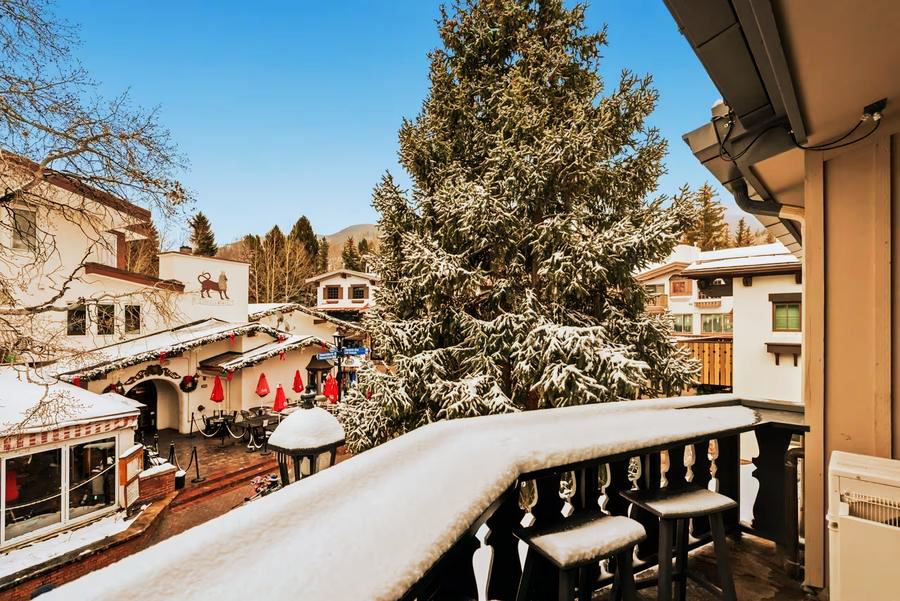 The balcony at 291 Bridge Street in fresh snow, looking down on the Red Lion and Vail Village